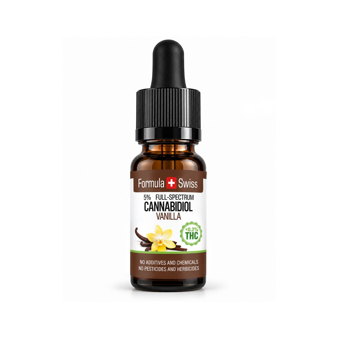Flacon compte-gouttes ambré d’huile de CBD Formula Swiss Vanille, 5 % spectre complet, étiquette ornée de fleurs de vanille